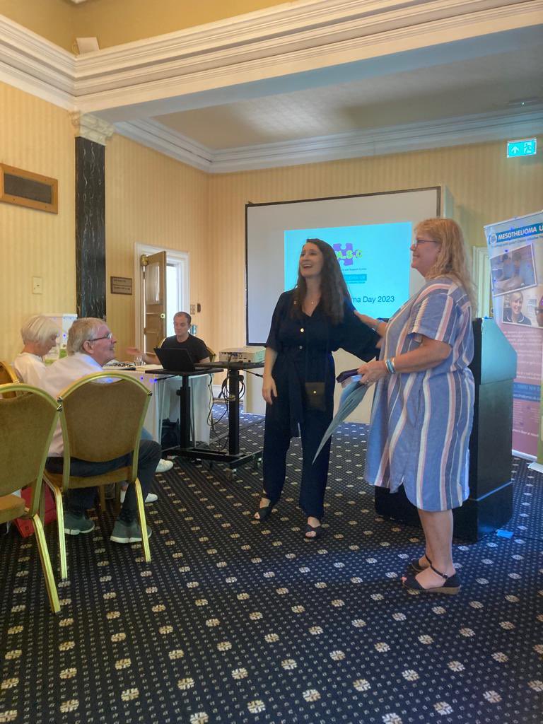 AASC2's tweet photo. Sarah Morgan #MesoUk and Jo #AASC encouraged guests to get involved, take action, raise #Asbestos #Awareness, spread the word about #support, light up blue at home with LED lights provided in action packs, donate and #volunteer to fight #mesothelioma on #AMD23 https://t.co/mqnX3PhnD2