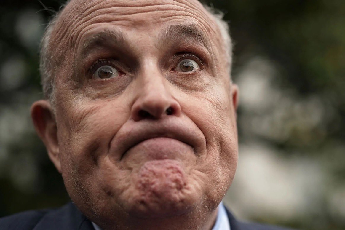So it looks like Rudy Giuliani, the cousin marrying, butt dialing, parking lot presser next to a dildo store holding, lie down on a hotel bed for Borat’s fake daughter shirt “tucking”, airport restaurant shaving, hair dye leaking, Covid via fart spreading, trumpy pardons for $2