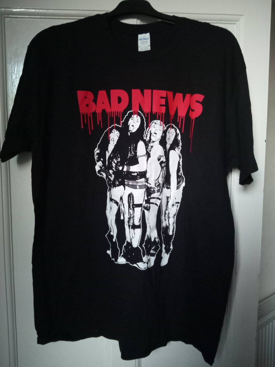 Zoe_Read's tweet photo. The postie has delivered something really cool! My Bad News t shirt from the man, the myth, the legend himself, @NigelPlaner1! This has made my week! Bad News were some of the coolest guys out there so to have this in my hands, is really special to me. Can't wait for the book! 🤩 https://t.co/jCiG4xvbL1