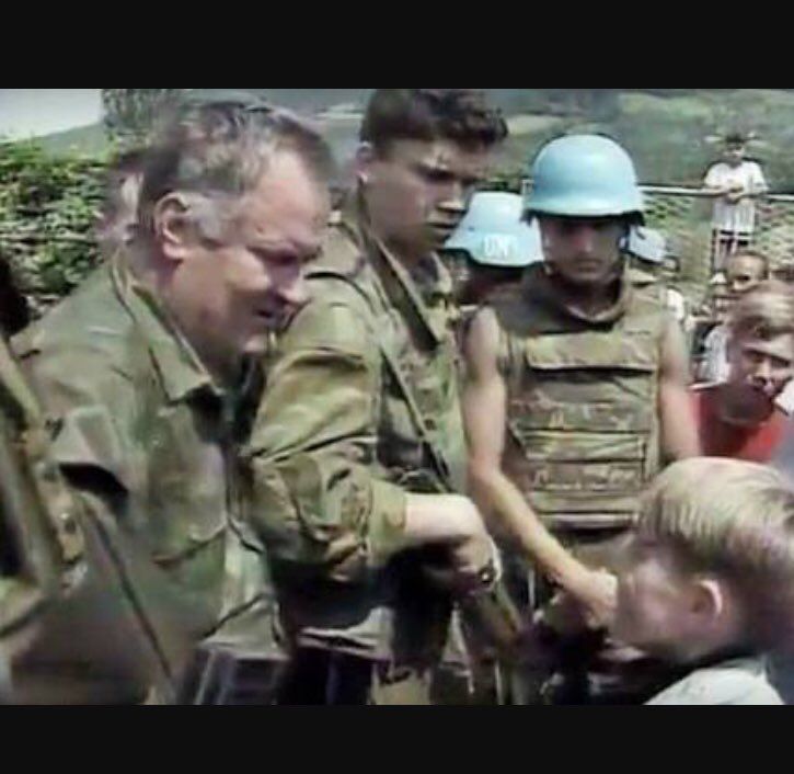 Ratko Mladic pats a Bosniak boy on the head, saying, "don't be afraid," as his soldiers proceed to murder 8,372 men and boys, dumping their bodies into secondary and tertiary mass graves. #Srebrenica