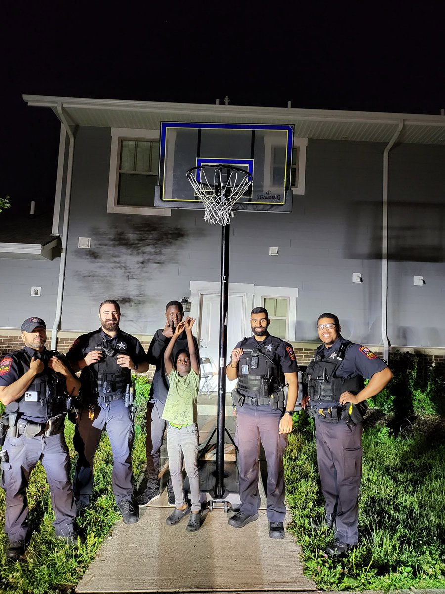 NCPD_Police's tweet photo. The North Chicago Police Department was patrolling the Brookstone Regency housing complex when a juvenile resident requested assistance in assembling a #basketball hoop. It took a team effort, and we were able to get it done. This is just one example of our #CommunityPolicing https://t.co/MjzEAHgzo6