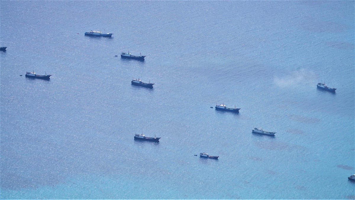 sentdefender's tweet photo. The Armed Forces of the Philippines is expressing “Severe Concern” about a Flotilla of roughly 48 Chinese Fishing Vessels being Escorted by Ships of the Chinese Coast Guard and Navy that have recently appeared in their Exclusive-Economic Zone near the Iroquois Reef and the Sabina Shoal of the Southwestern Coast in the South China Sea; this Coastal Area is very close to the Reed Tablemount which is Extremely Rich in Oil and Natural Gas.
