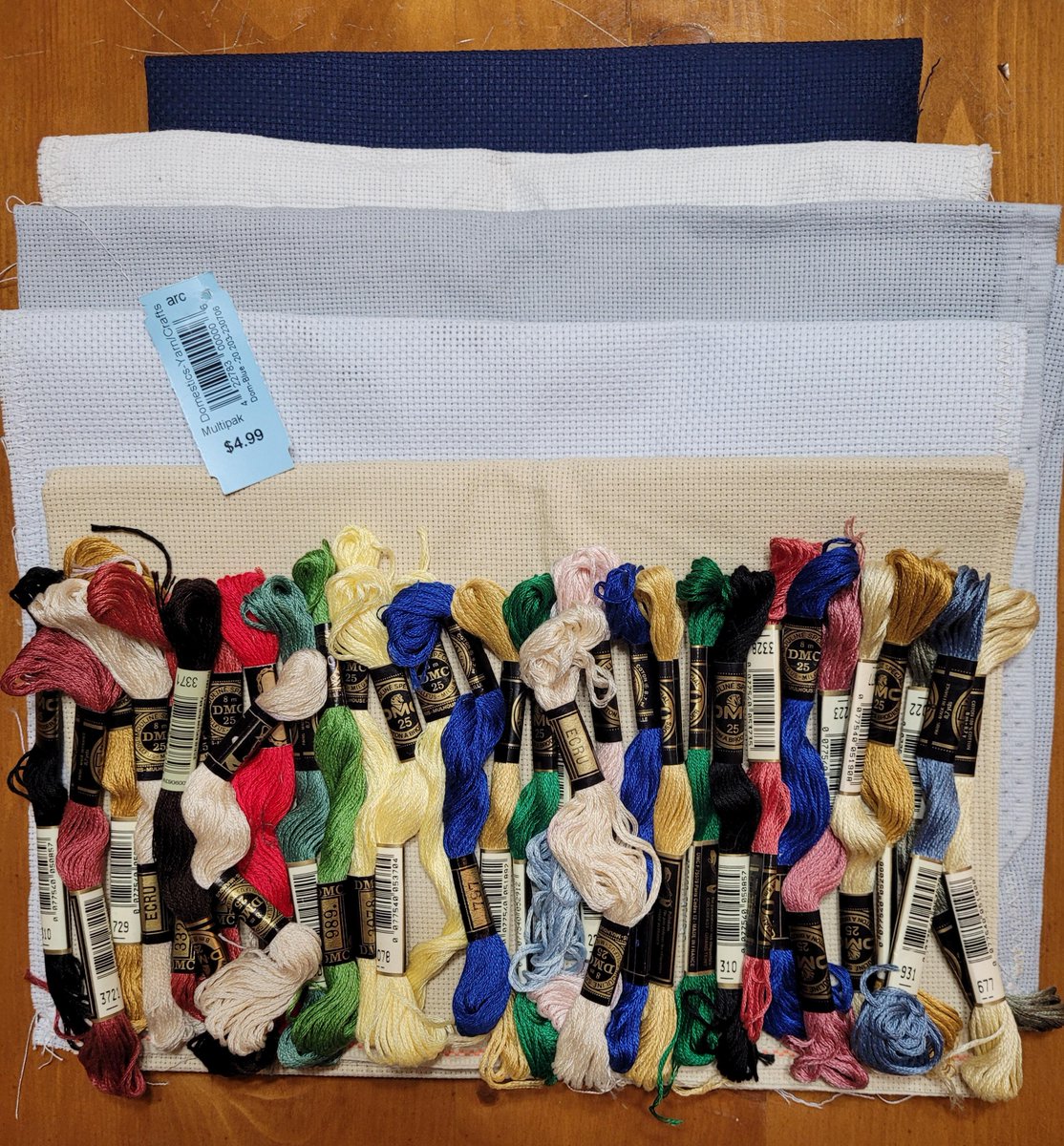 SeeingTwo's tweet photo. 3/4 #FridayNightFind ($4.99) at a local charity shop is 5 decent pieces of aida & 31 DMC skeins. It might be hard to tell but the cloth is tan, light blue, dusty blue, white, & dark blue. https://t.co/Zobl8GLLO1