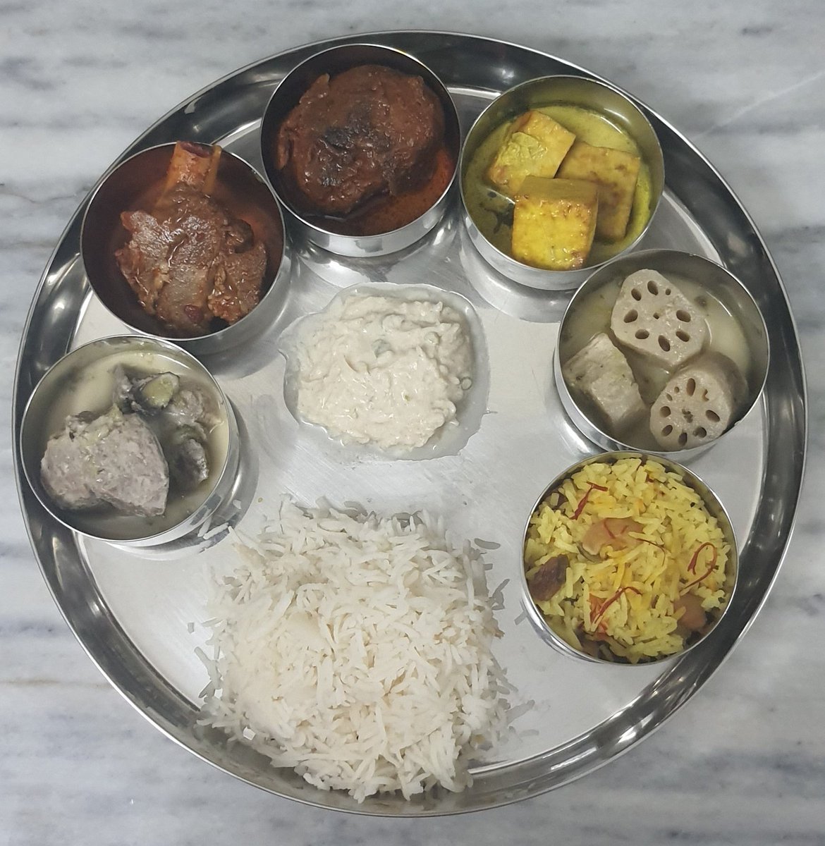 On my plate for dinner last night were some classic dishes from #KashmiriPunditCuisine - steamed rice, Mutton Yakhni, Roganjosh, Dum Oluv, Paneer Qaliya, Nadur Yakhni, Mooli raita and Meethe chaval. Thank you for a wonderful meal <a href="/chefrahulwali/">Rahul Wali</a>