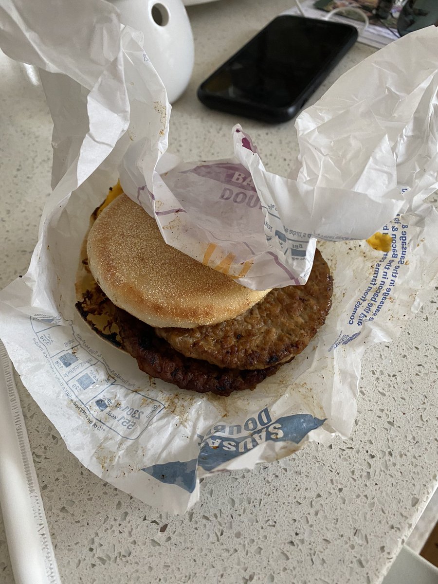 anntenison's tweet photo. @McDonaldsUK not the best breakfast this morning, a thrown together, burnt, double sausage egg McMuffin and a luke warm flat white + a 26 minute wait for it, having preordered in the app. https://t.co/yrFQPbVfZB