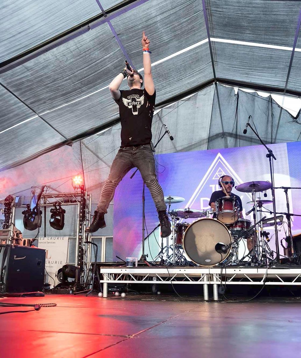 Steven Wodecki lead singer @TheDirtySmooth jumping high at @minetyfestival last weekend celebrating a great show. erichobsonphotography.co.uk