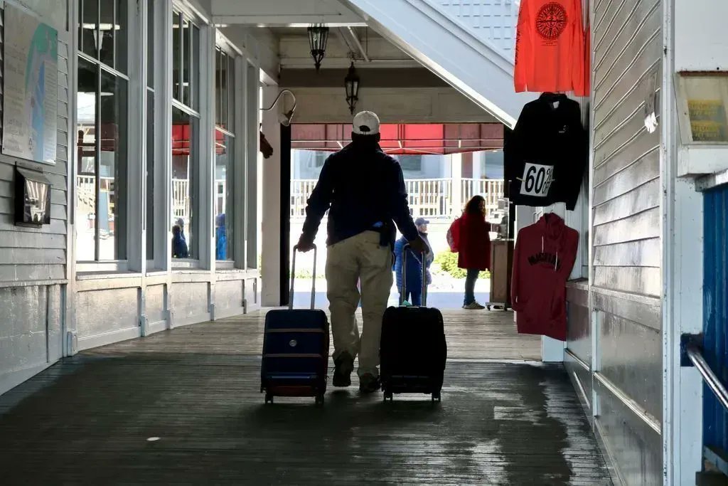 MackinacGuide's tweet photo. When you get off the ferry a porter will transport your luggage to your hotel. Be sure to tip them. They work hard rain or shine. #mackinacisland #makeitmackianc #visitmackinac https://t.co/PwunB2z22M