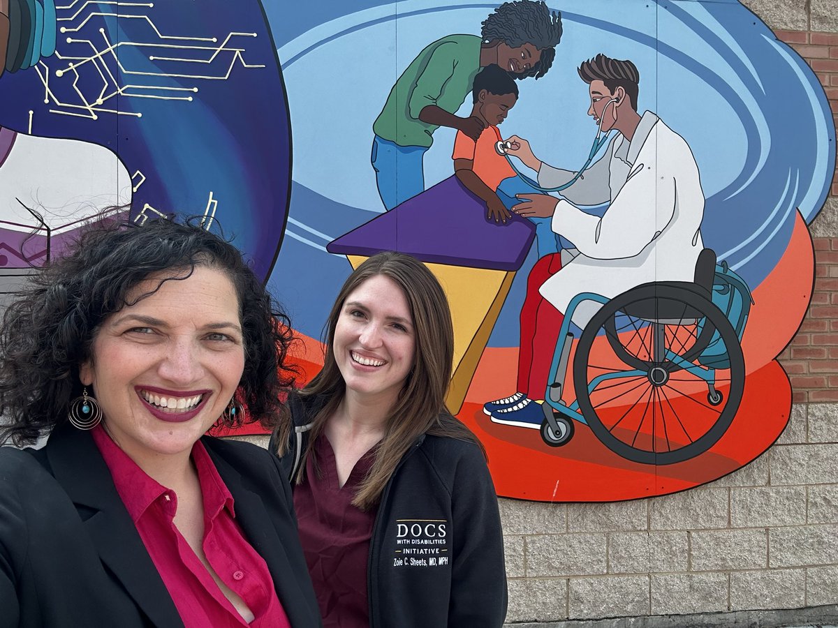 When I worked with @iamsamkirk on our mural at @MOPDChicago, I wanted representation of doctors with disabilities. Many are involved with #DocsWithDisabilities. Dr. @ZoieSheets tweeted how powerful this image is.  We met up in front of the mural. Check out what her jacket says!