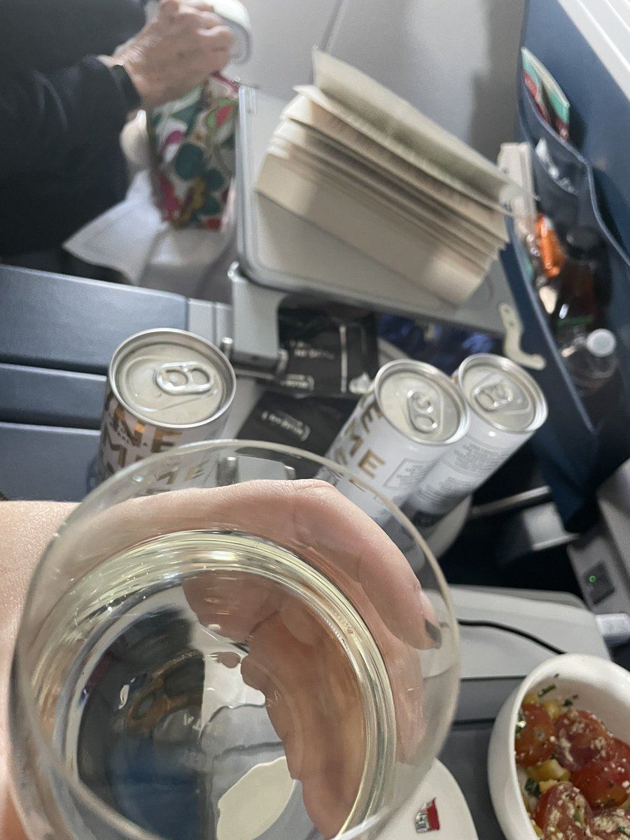 atomicblondedj's tweet photo. oh. the flight attendant said “drink for everyone then” 🥂 https://t.co/6a29uWpa8y