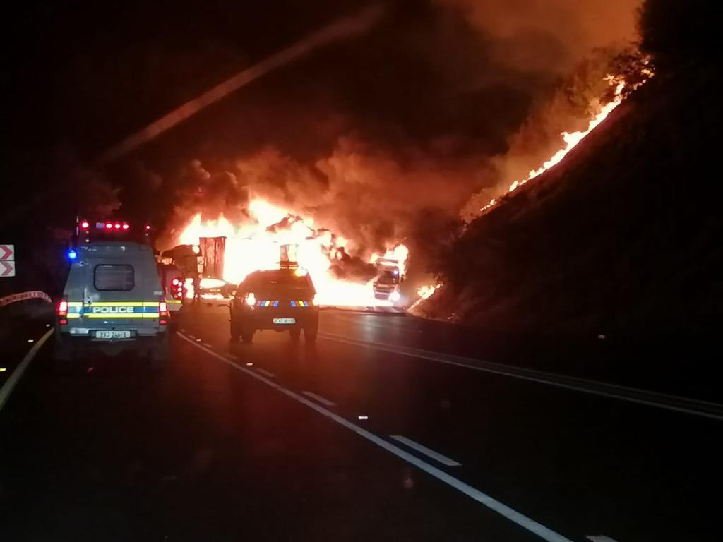 Abramjee's tweet photo. A gang of armed men forced six trucks drivers to stop their trucks on the Van Reenens Pass last night. They then set all the trucks alight, causing the road to be closed. No injuries were reported. The motive for the attack is unknown. Van Reenen detectives are investigating a case of Malicious Damage to Property. A large police deployment including the @SAPoliceService Public Order Policing Unit is monitoring the situation. The road is still closed at this stage.
