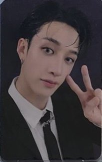 bang chan holding a bouquet of flowers AND a white rose AND