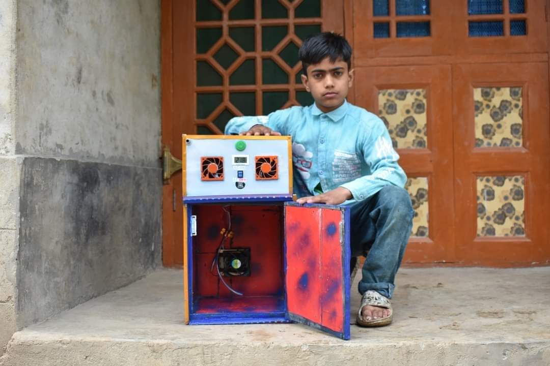 After developed an egg incubator; Momin Ishaq Teli, a 10-year-old boy from Munad Gufan area of Kulgam district has now developed a multitasking machine too which can be used as freezer, cooler, room heater and refrigerator. Photo by~ Ikhlas Gulzar