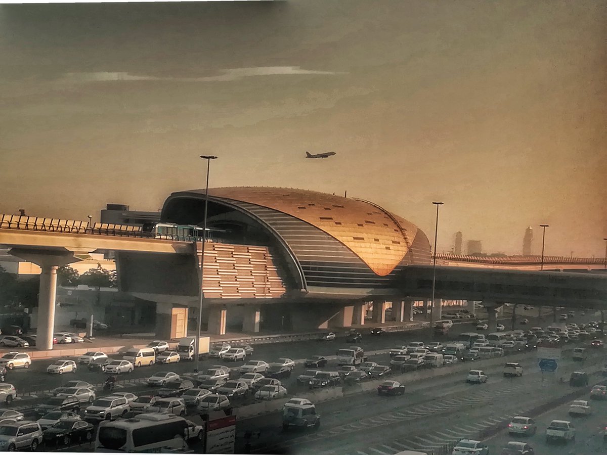 isam45811's tweet photo. This picture taken from my office. The train enters Al Qiyadah Metro Station. The plane is also flying to its destination from Dubai International Airport. #skyporn #cloudporn #skyphotography #skymasters_family #cloudnails #nature #landscape #sunset #car #viralpost #dubailife https://t.co/sz5jyXpjdl