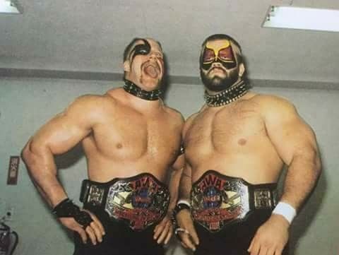 wrestlerweekly's tweet photo. The #RoadWarriors pictured here with the #AWA World Tag Team Titles. The Road Warriors are the only team to hold the AWA, #NWA, &amp; #WWF Tag Team Championships! #ML https://t.co/HiDQO1lnlq