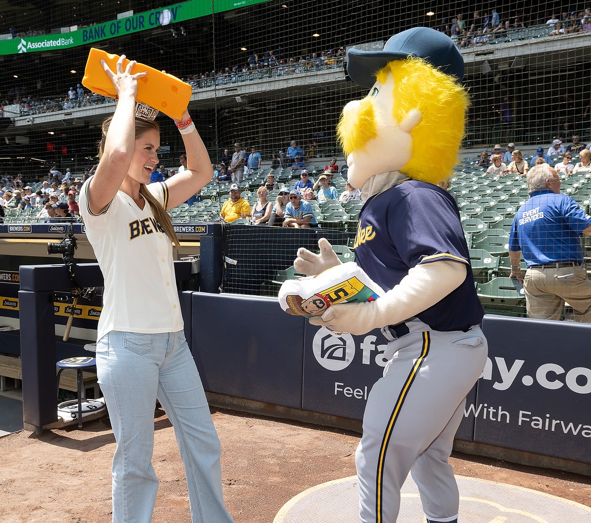 Brewers's tweet photo. A new piece of headwear for Miss America. 🧀

Wausau native and Miss America, @Grace_Stanke, joined us today to throw out the first pitch and receive her very first cheese head. 

#ThisIsMyCrew https://t.co/7wlfiK8S4w