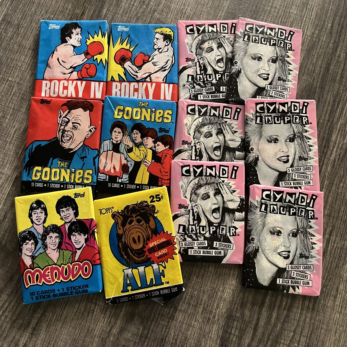 ricklovesthe80s's tweet photo. When you clean out your spare closet and find some sealed @Topps #waxpacks from the 80’s in a shoebox. #RockyIV #TheGoonies #CyndiLauper #Menudo #Alf #80sTradingCards #HeyYouGuys #80sCollection #80sCollector #Topps https://t.co/JHNXlJJNTn