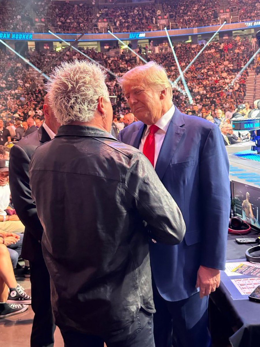 PopCrave's tweet image. Guy Fieri greeting criminal defendant Donald Trump at UFC 290 in Las Vegas.