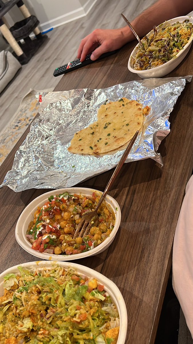 thesassytruth's tweet photo. my hubby is willingly watching with me and we got takeout from a new place that’s like chipotle with an indian twist?! it’s so good!! https://t.co/nvti5JH5XD