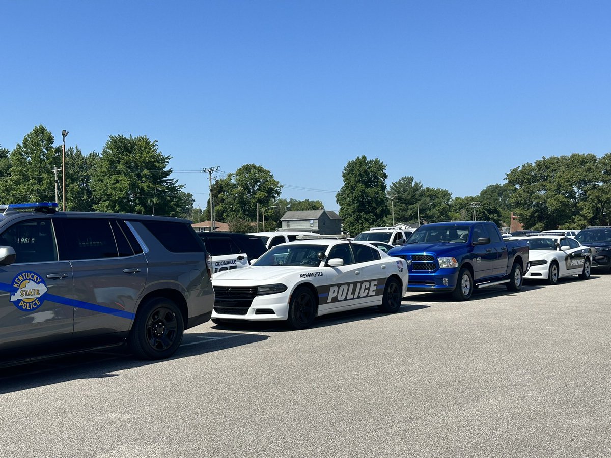 egdesantis's tweet photo. First responder vehicles from all over the Tri-State are parked at Tell City High School as people gather to pay respects to Sgt. Heather Glenn @14News https://t.co/KOy04SS9k4