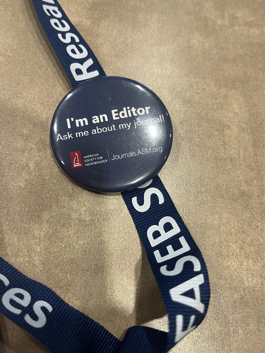 At faseb 2023 wearing my Editor Pin. Come talk with me about @JVirology and my new role handling #phage and #giantvirus papers 🙂 send me your manuscripts!
