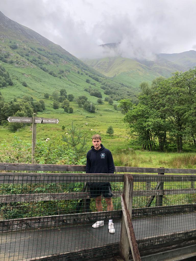 BidefordAFC's tweet photo. 𝗔𝗮𝗿𝗼𝗻’𝘀 𝗖𝗵𝗮𝗹𝗹𝗲𝗻𝗴𝗲 𝗕𝗲𝗴𝗶𝗻𝘀 🏔️ 

Our captain Aaron Taylor is at Ben Nevis and is just about to set off with his team. They are climbing the UK’s three biggest mountains in 24 hours to raise money for the @BrainTumourOrg ⭐️ 

➡️ https://t.co/rGJCqek7XF https://t.co/sdVdmUoE8G