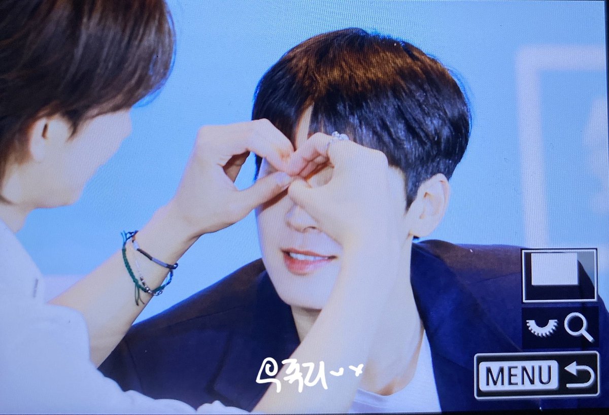 tinkswonu's tweet photo. wonwoo couldnt see so shua made glasses shape with his hands 😭 https://t.co/A1vxGz0v8l