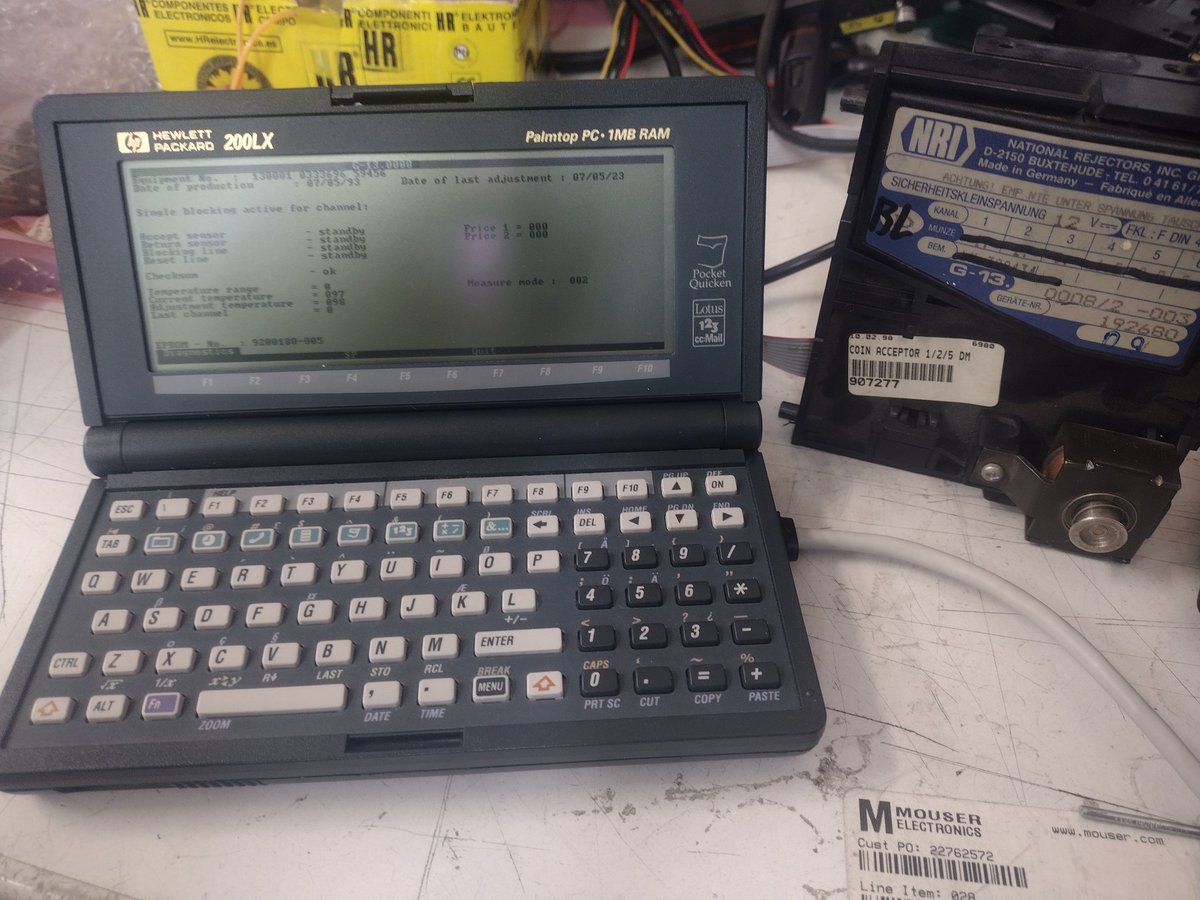 My tiny 200Lx palmtop doing some real work. Programming/diagnosing coin mech for arcade machine.