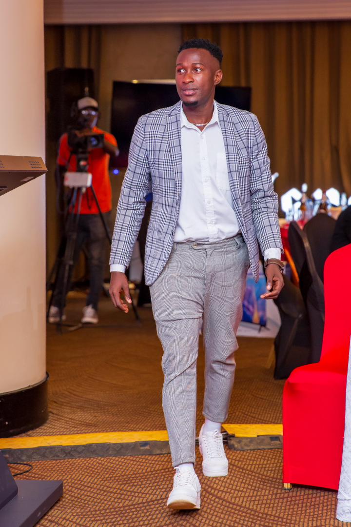 Stylish... Let's rate his fashion choice. @BukenyaLawrenc at the Pilsner UPL Awards #PrideOfWakiso #WeArePurpleSharks