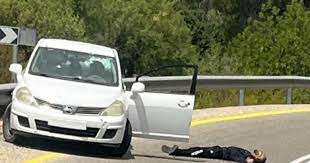 SaveSJarrah's tweet photo. Bilal Ibrahim Qadah, 33, a father of three, was in his car driving close to the Palestinian village of Deir Nidham and the Israeli settlement of Khalamish when his car was hit from the back. Qadah laying on the floor next to his car after being shot by #IsraeliTerrorism soldiers. https://t.co/LnGI03RT59