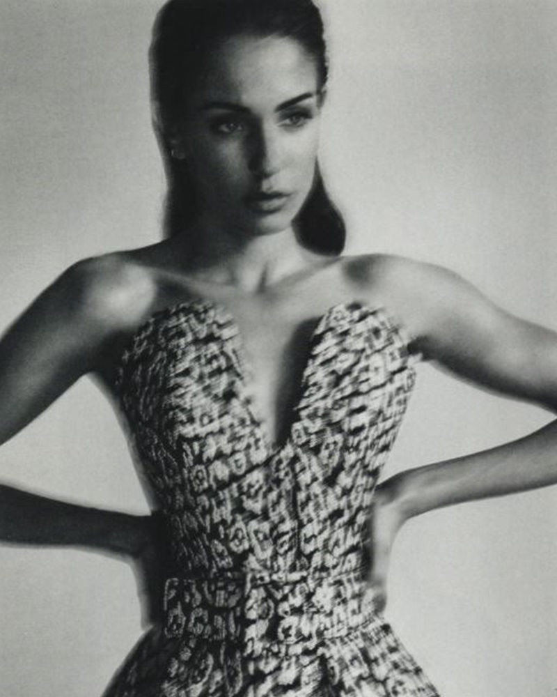 Fierce and Grace: Hiba Abouk wears the strapless peplum top and belt from Carolina Herrera Pre-Fall 2023 collection by Wes Gordon featured in Elle Spain. Photographed by Xavi Gordo and styled by Barbara Garralda.