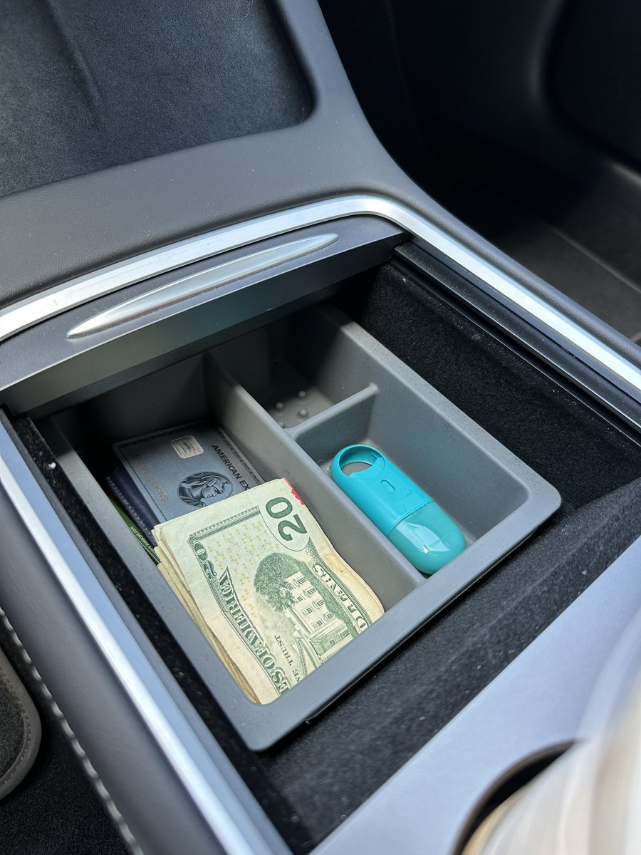 The Tesla Model 3/Y both have this deep cavernous hole that is begging to be filled. This organizer from @JowuaLife works really well. I use it to organize my cash that I found after doing Brian’s laundry, his Amex, and also my throat numbing spray. 10/10 product. https://t.co/2edeD8bWuH