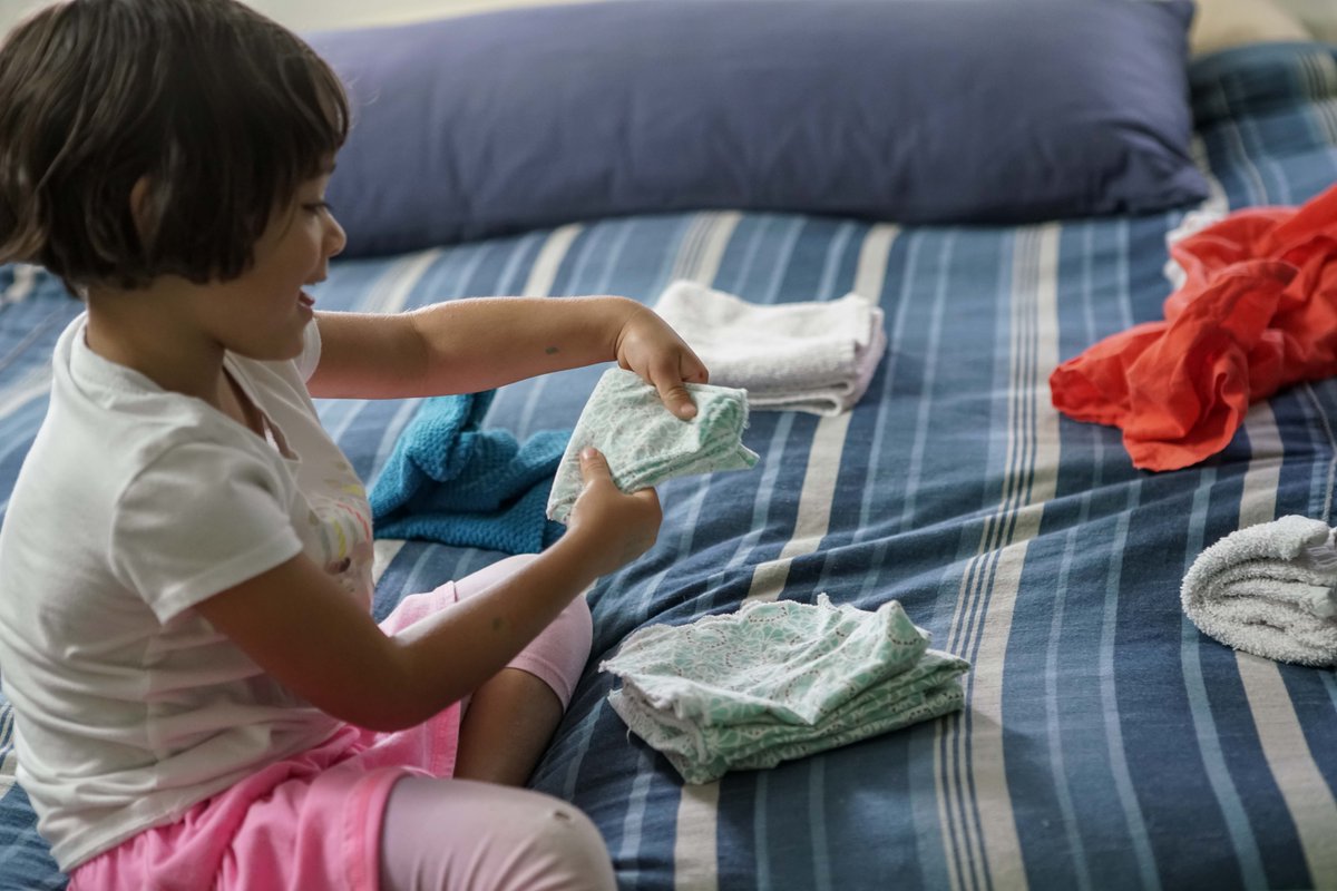 Laundry time? Give your little one a chance to explore textures before you fold. Pass clothes to them &amp; ask how each feels. Soft, rough, thin? This game helps your child "think like a scientist" because they use their senses, including touch, to understand the world around them.