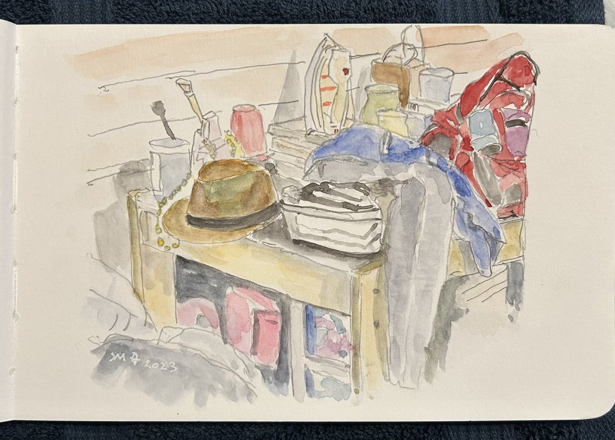 Day 10 Prompt,”Clutter”. Sad to say this is not a staged photo ref but the corner of a table in my bedroom! Done with graphite and watercolour wash in my Muxed media sketchbook. 
#worldwatercolormonth2023