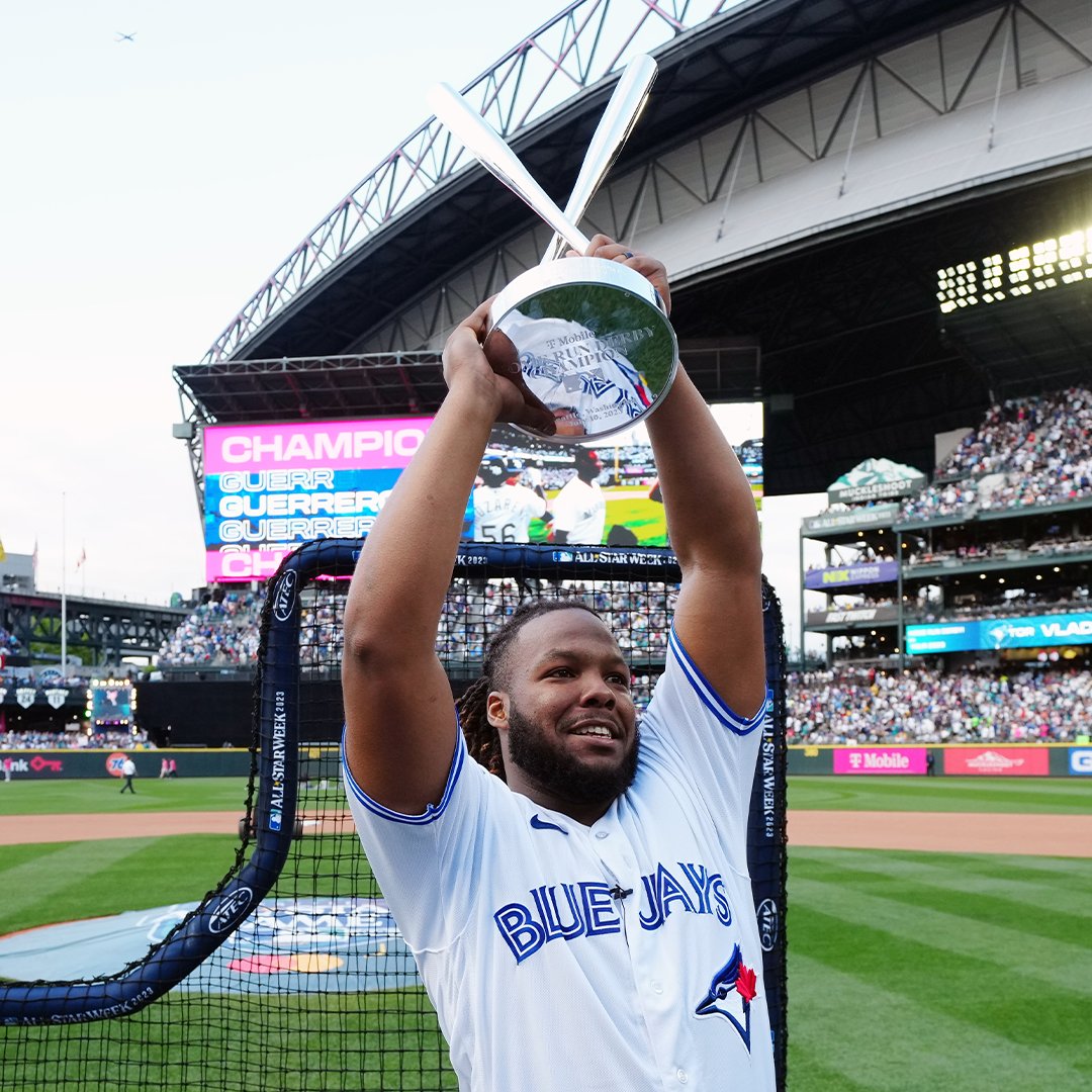 Vladimir Guerrero Jr. holds the the trophy above his head after winning the T-Mobile Home run Derby.