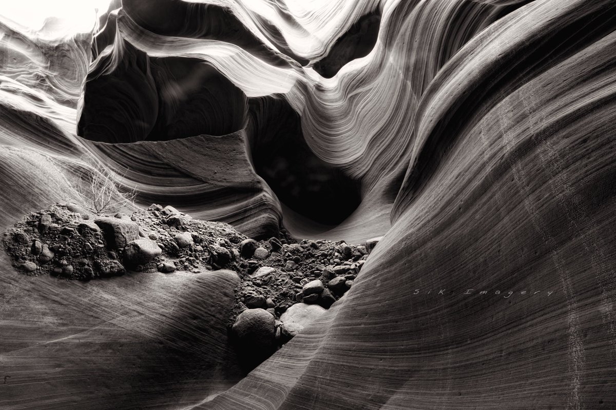 Happy #Tuesday my friends. Today let’s see your #blackandwhite shots!
I don’t do #BW very often. I feel I’m not very good at it…but I love seeing them!  Here’s and old shot from #AntelopeCanyon in #Arizona. I loved the contrast between smooth walls and the pile of rough rocks.