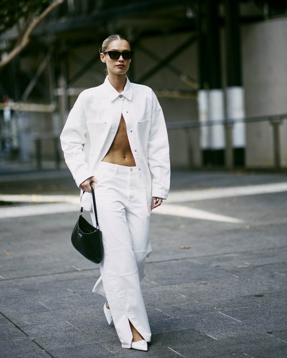 A lesson in all-white outfitting. #AAFW street style photo by Myles Kalus.