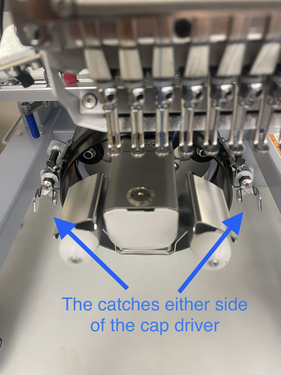 When attaching your framed cap to the cap driver on the machine, ensure that the sprung catches on either side are holding the cap frame securely in place. In the second picture, the catch isn’t latched onto the cap frame correctly, which will result in logo movement. 

#barudan