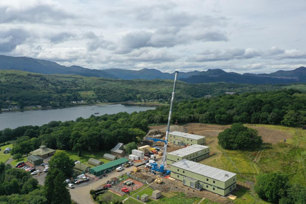 reds10ltd's tweet photo. Work continues on our most northern site at Greenfield Camp in Garelochhead, #Scotland. Over just 1 week, 51 units making up 3 double-storey accommodation blocks landed, despite rain. We are delivering #NetCAP alongside @landmarcNEWS & @mod_dio for @BritishArmy. @ArmyBasing https://t.co/CFwLBtUx0o