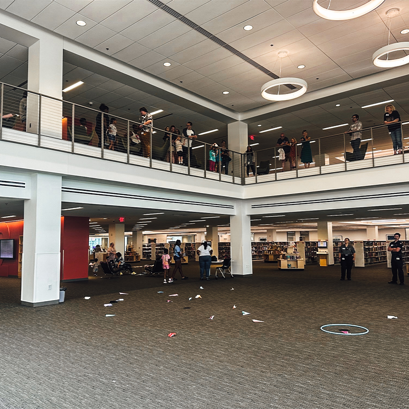 columbuslibrary's tweet photo. Launching Paper Airplanes from our third floor? Absolutely. Main Library celebrated Second Saturday with Aviation and Science Day! Participants heard about the History of Pan American Airways, participated in COSI's science program and had a paper airplane contest! @PanAmMuseum https://t.co/ynmVjYbHor