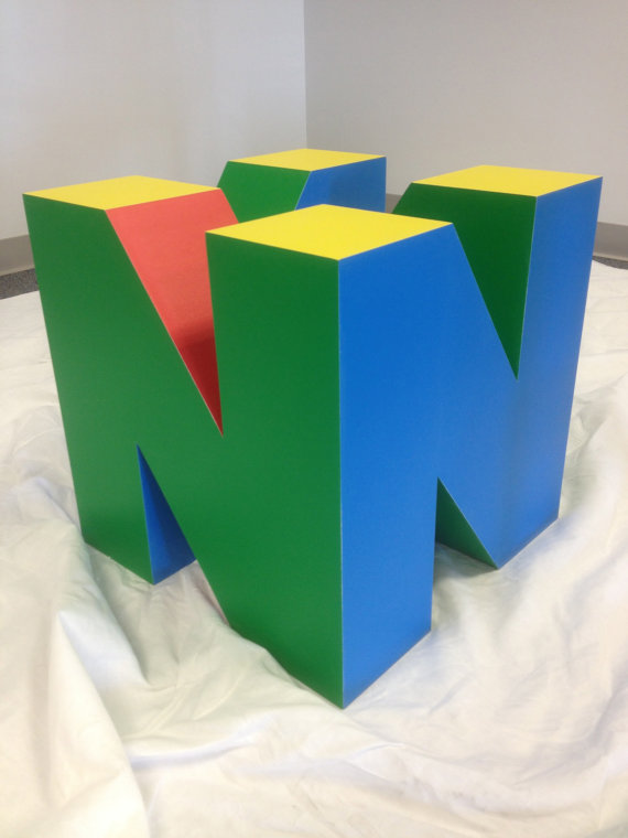 Dexerto's tweet photo. The Nintendo 64 coffee table is crazy https://t.co/Kx1m2jtDd1