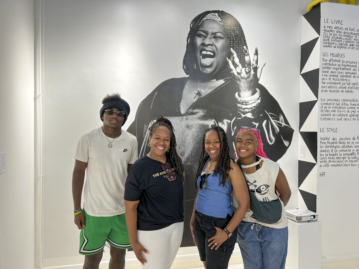 A family of four from South Carolina poses in front of a photo portrait of Carole Denise Fredericks at the Little Africa Village in the 18th arrondissement.

Are you coming to Paris soon?  Click here to learn about our walks and other activities:  entreetoblackparis.com.