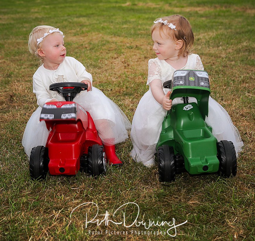 The #redvgreen tractor debate begins early! These two adorable #flowergirls exchanging views on their #masseyferguson and #johndeere toy tractors