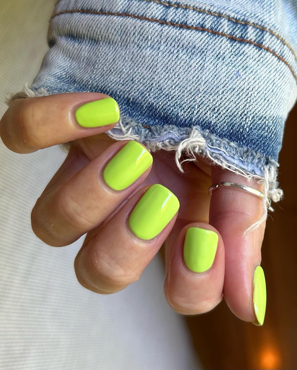 In our lime green apple nails era &gt;&gt;&gt;&gt;&gt; 🍏💚 @nailsncolour is in summer mode with our vibrant limited edition green hue 'Summer Monday-Fridays' 
#neonnails #greennails #neongreennails #shortnails #summernails #trendingnails #summernailinspo #boldnails #colourfulnails