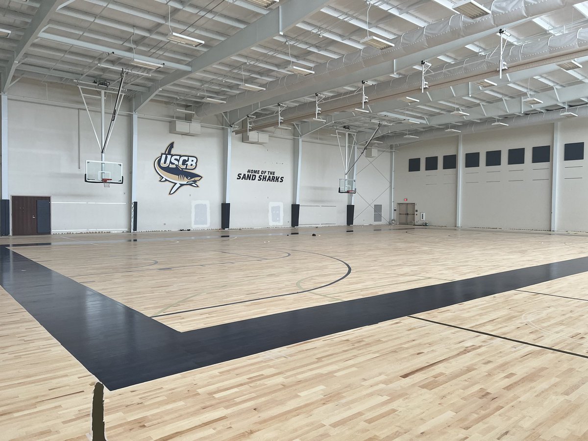 Check out the latest update on our floor! Got the tape laid yesterday and the first coat of paint went on today! #RisingTide #FinsUp #ForEachOther 🏀🦈