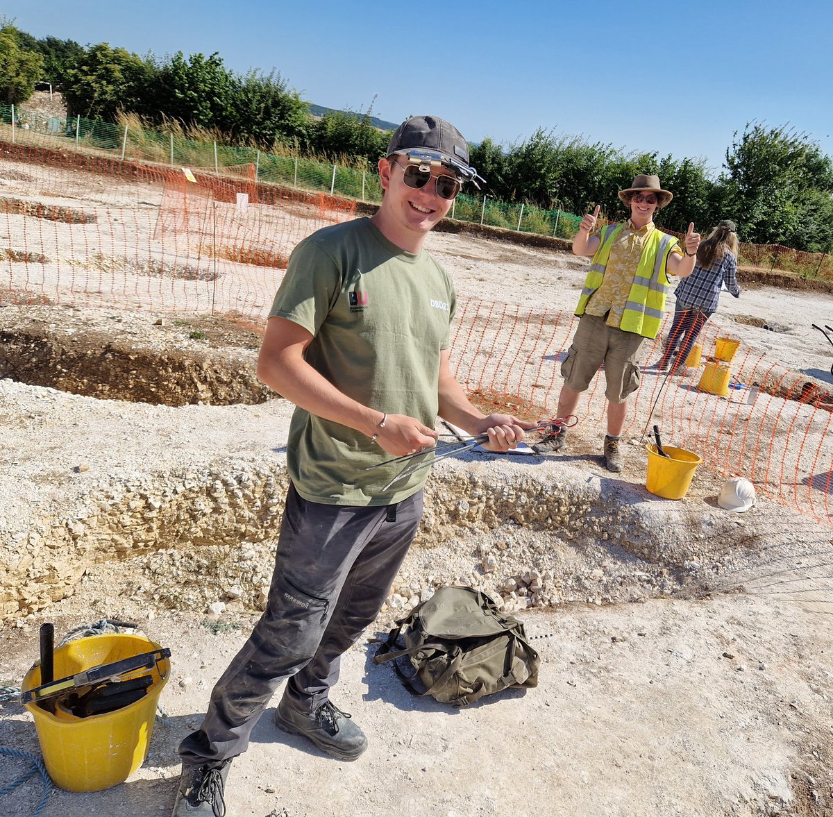 Durotrigesdig's tweet photo. Lewis and Jack have completed the excavation of their Iron Age Storage pits at #Durotriges23

Jack is wearing an epic shirt

Lewis has bulldog clips on his hat

They are both happy 👍 https://t.co/PvDTNkTPKL