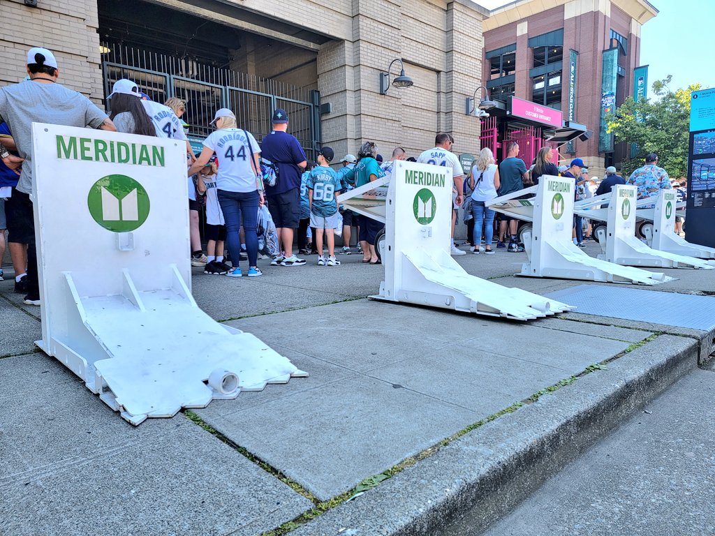 caseyworks's tweet photo. SPD officer says these temporary barriers were setup by Homeland Security and can stop a semi. Protecting people on sidewalks around the ballpark seems like a good idea not just this week but all the time. Black or dark green bollards could look better than these. https://t.co/mqXCrYgOoY