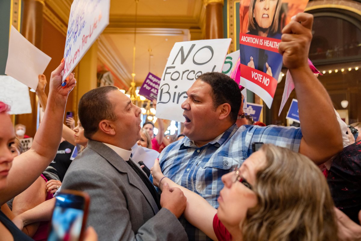 Pastor Michael Shover of Christ the Redeemer Church in Pella, Iowa, left, argues with Ryan Maher, of Des Moines, as protesters clash in the Iowa Capitol on Tuesday during the legislature's special session to pass a 6-week “fetal heartbeat” abortion law. desmoinesregister.com/story/news/pol…