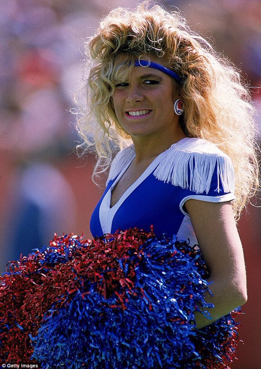Andre Agassi revitalized tennis with his brash style - hang on, being told this is just a Buffalo Bills cheerleader.