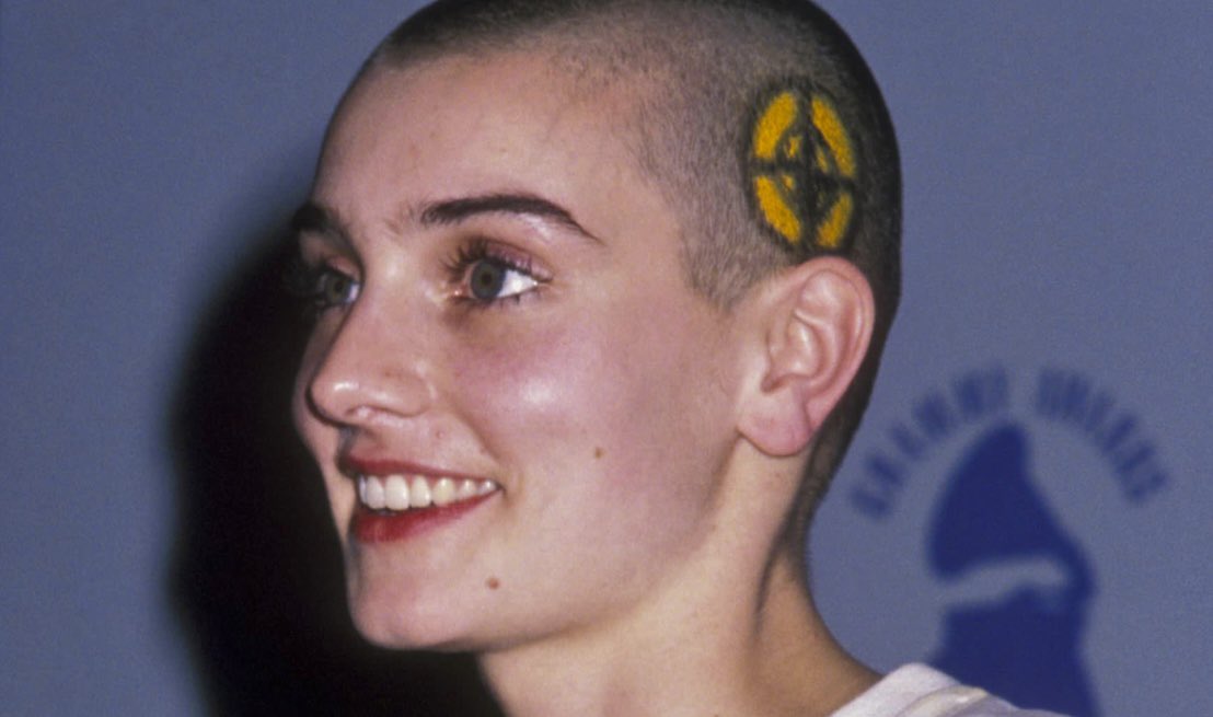 RIP Sinead O’Connor 🕊️ This pic is from the 1989 Grammys when she shaved the Public Enemy logo in her head in support all who were boycotting the event due to the hip hop category not being televised. She def was a real one. 🙏🏼💐