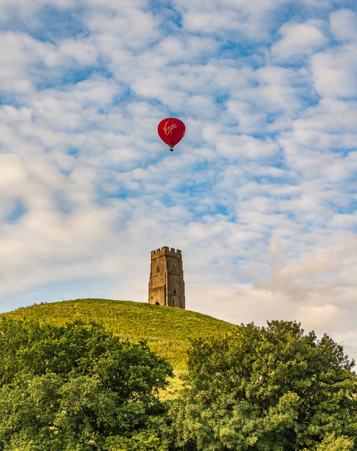 Amazing photo from Somerset Day official partner @glastomichelle with the hot air balloon atop the Tor ! #Somerset #glastonbury